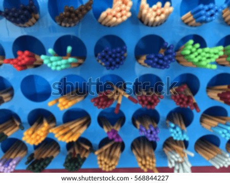 Stationary of pens and pencils in colorful on motion blur effect