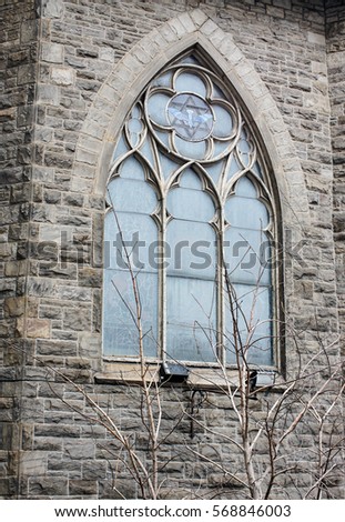 exterior vintage window on an old stone church