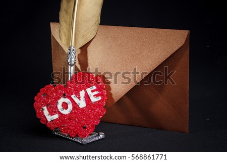 Valentine concept: Love letter with writing quill, sealed with glittering heart symbol