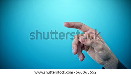Cropped image of businessman pointing against blue vignette background