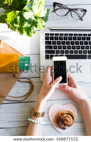 concept girl online shopping with laptop mock up top view
