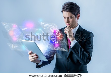 business person holding futuristic tablet PC Royalty-Free Stock Photo #568889479