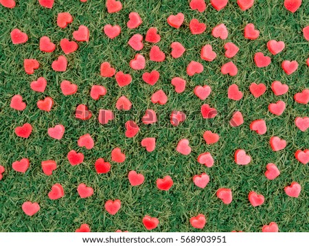 heart shape made from candle on artificial grass, valentine's day