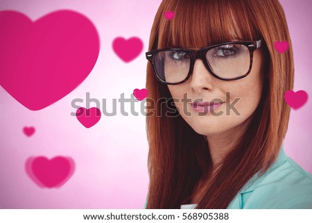 Portrait of a smiling hipster woman against pink background