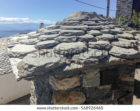 Top view on slate roof with chimney. Makrinitsa village, Pelion, Greece.
