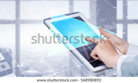 Tablet pc in woman hands . Mixed media