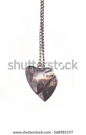 background picture of two brass hearts, love concept for Valentine day