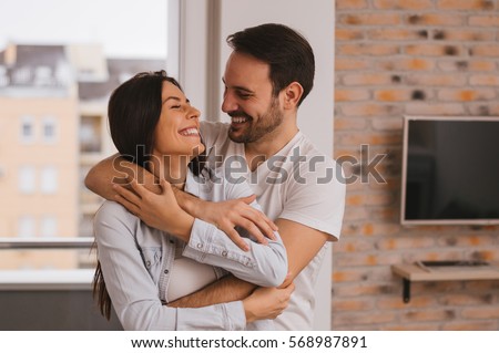 Beautiful couple hugging and looking at each other