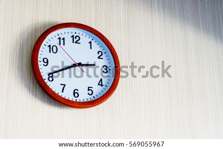 clock hanging at the wall with copy space