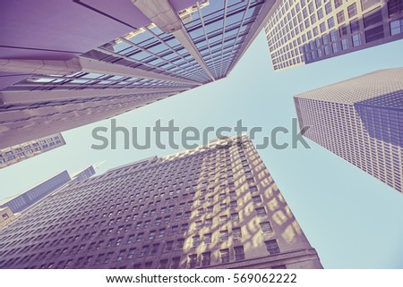 Color toned picture of Skyscrapers in Chicago downtown, looking up perspective, USA.