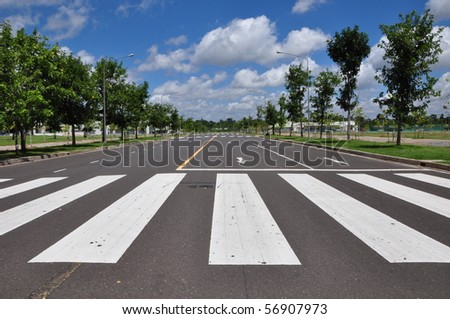 zebra traffic walk way with blue sky