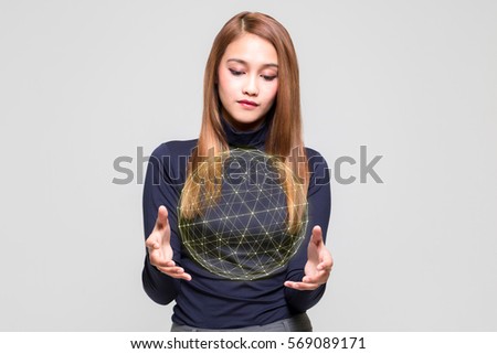 young woman looking at a abstract object floating on her hands, communication network concept.