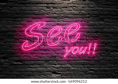 SEE YOU. fluorescent Neon tube Sign on dark brick wall. Front view. Can be used for online banner ads or background. night moment.
