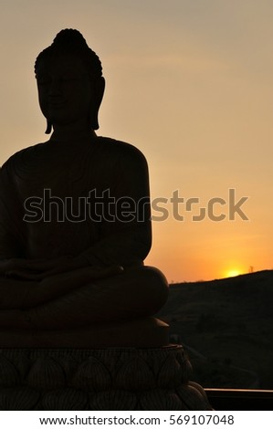 Buhhda status and sunset at WatPhasornkaew, North of Thailand