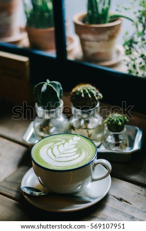 Focus Cup of Greentea latte art in coffee shop on thailand Japaness&hipster Style