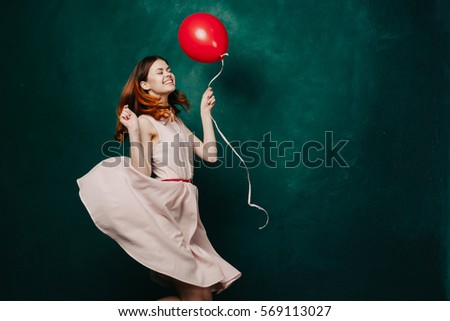 Happy young woman relax and have fun with balloon in hand