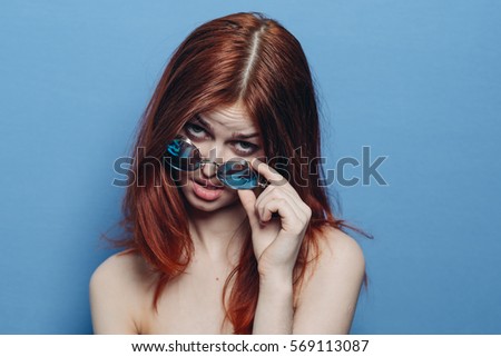 A woman looking a little clearing glasses from top to bottom, beauty model