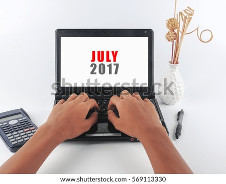 man typing on a laptop on white background with text JULY 2017