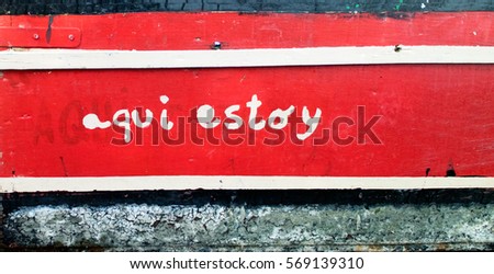  Aqui Estoy - hand painted lettering on weathered wood with red paint.