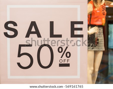 50% off. Sale and discount price sign on the wall in Department store.