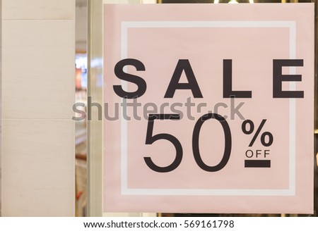 50% off. Sale and discount price sign on the wall in Department store.