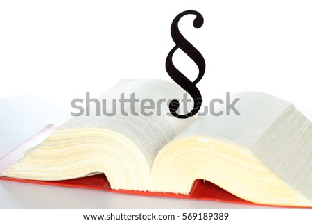 black paragraph symbol on an opened book