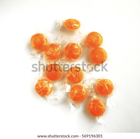  candy and sweets of various shapes and colors on a white background. photos micro-stock