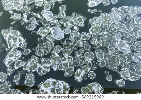 Ice floes floating on the river. Top view. Vistula River in Poland.	