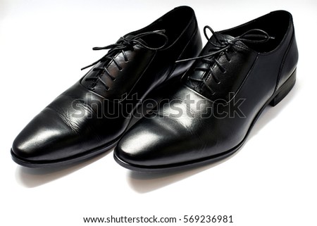 A pair of leather elegant shoes on a white background Royalty-Free Stock Photo #569236981