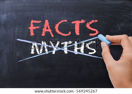 Myths or Facts concept with business woman hand drawing on blackboard  Royalty-Free Stock Photo #569245267