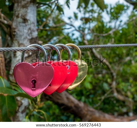 Conceptual image of love, a symbol of the vows of love and fidelity forever. Love Heart Locks on bridge in Sky bridge Langkawi in Malaysia