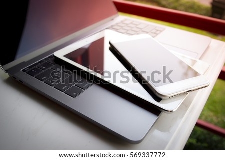 Electronic device computer laptop tablet phone.  Royalty-Free Stock Photo #569337772