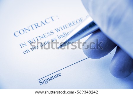 Man holds a blue ballpoint pen preparing to sign a contract. Formation of a contract generally requires an offer, acceptance, consideration and a mutual intent to be bound.