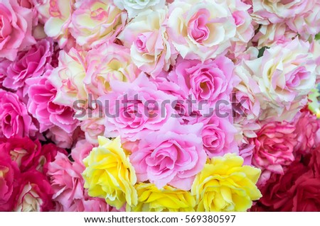 Colorful fabric flowers background pattern lovely style. Close-up decoration flowers.