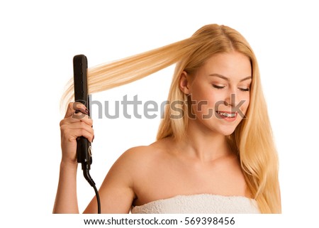 Woman straighten her hait isolated over white background