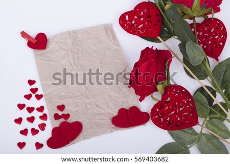 Red roses and red  hearts on a white background
