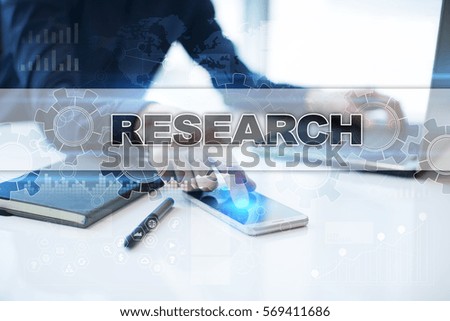 Businessman working in office, pressing button on virtual screen and selecting research.