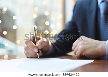 Signing agreement Royalty-Free Stock Photo #569434432