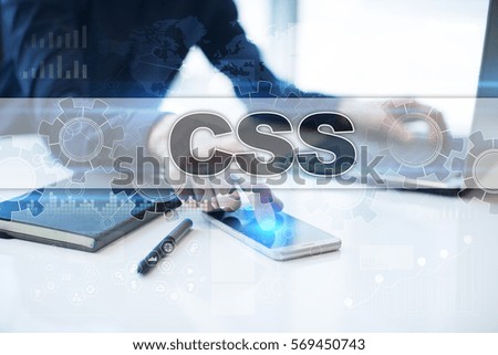 Businessman working in office, pressing button on virtual screen and selecting css.