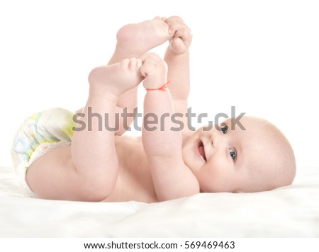 Adorable baby boy  in pampers Royalty-Free Stock Photo #569469463