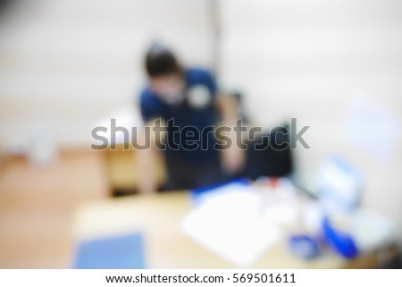 Picture blurred  for background abstract and can be illustration to article of businesswoman talking on telephone in office