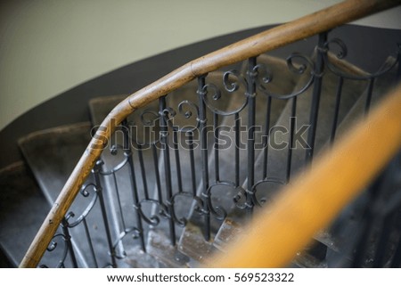 The staircase in the house. Wooden railings.