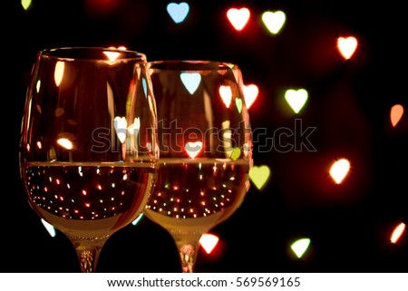 wine glass on hearts background, concept of valentine's day