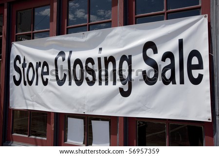 Store closing sign on small retail store.