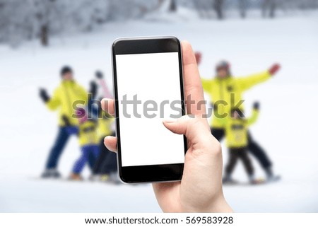 Mother takes a picture of your child in the classroom in kindergarten ski. Blank screen cut from place to copy. Background with shallow depth of field.