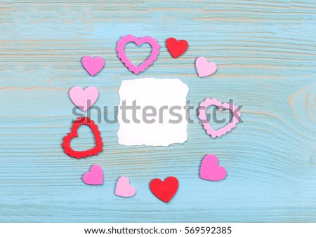 Red paper hearts Valentines day card on white background.

