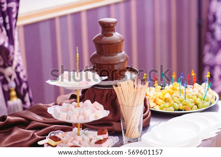 Vibrant Picture of Chocolate Fountain Fontain on party. 