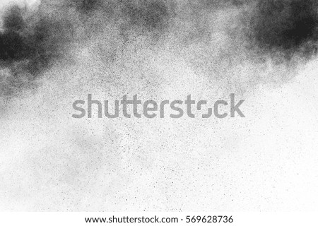 Black particles explosion isolated on white background.  Abstract dust overlay texture