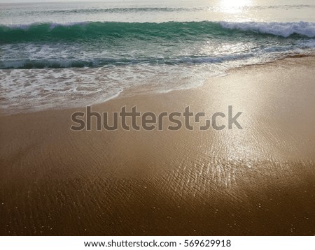 White ocean sea foam and natural sandy surface beach backdrop top view background