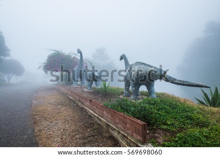 Model of Chiang Muang dinosaur with mist at Phayao province, Thailand.